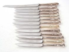 Six Kings pattern table knives and six matching dessert knives together with a hallmarked silver