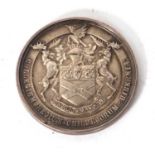 A silver presentation medal engraved "Preventative Medicine 1952", the front with the words