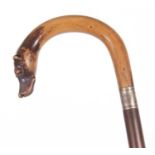Vintage walking stick, the curved handle with a dogs head having inset glass eyes and a metal