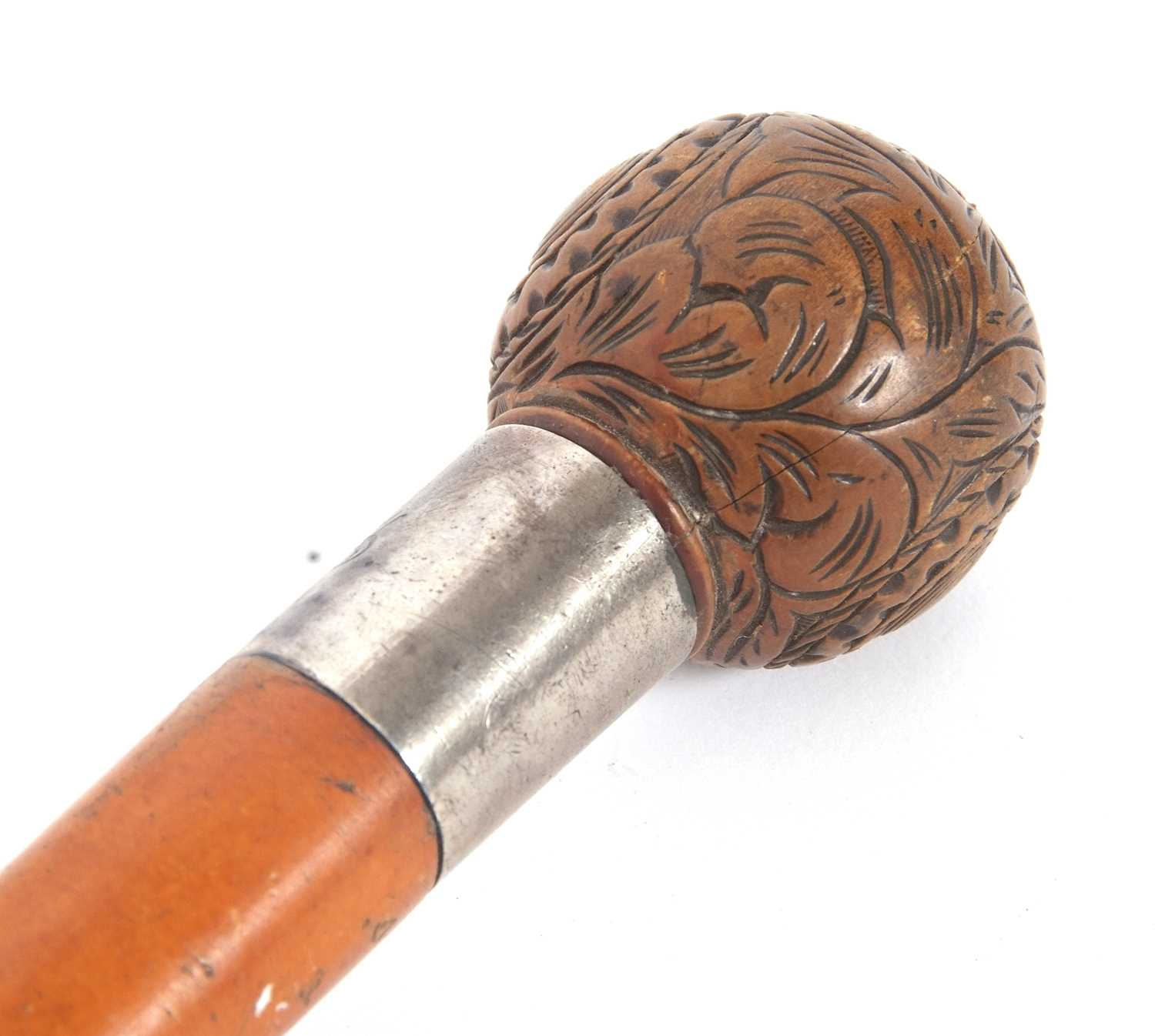 An antique walking stick with ball finial, carved with foliate and geometric designs with a metal - Image 4 of 10