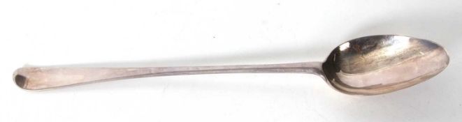 An antique silver basting spoon, Hanovarian rat tail pattern, base marked (rubbed), 37cm long,