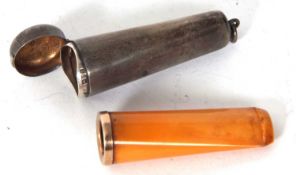 A George V silver cheroot holder case and amber 9ct gold mounted cheroot holder, each hallmarked for