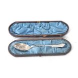 An antique silver plated decorative spoon in a fitted blue velvet lined and leather case (a/f)