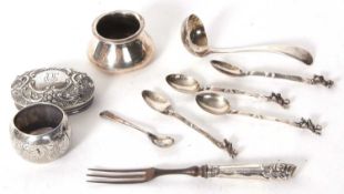 Mixed Lot: Two hallmarked silver lids and a serviette ring engraved "Brian", a silver ladle,