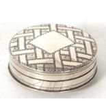 A George III silver patch box, chased and engraved with geometric design around a vacant