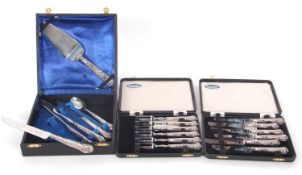 A cased set of six silver handled pastry forks together with a cased set of six matching knives,