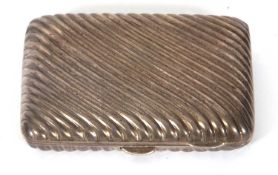 A hallmarked silver cigarette case of slightly curved rectangular form with all over wrythen design,
