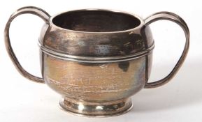 An Elizabeth II heavy silver twin handle sugar bowl of plain form, the body with reeded decoration