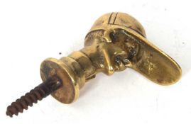 An antique brass cast jockeys head walking stick screw in handle, 9cm long