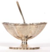 An Edward VII silver sugar basket of oval form, the fluted body engraved with a floral and scroll