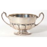 George V silver twin handle sugar bowl of circular form, the body with half fluted design, ornate