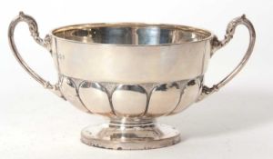 George V silver twin handle sugar bowl of circular form, the body with half fluted design, ornate