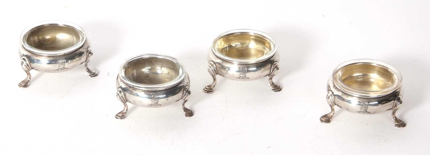 Four George III silver cauldron salts, raised on three hoof feet with later clear glass liners, - Image 2 of 5