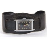 An Anker Tank style wristwatch, it has a crown wound movement and a black dial with luminous hands