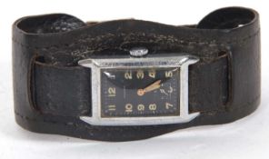 An Anker Tank style wristwatch, it has a crown wound movement and a black dial with luminous hands