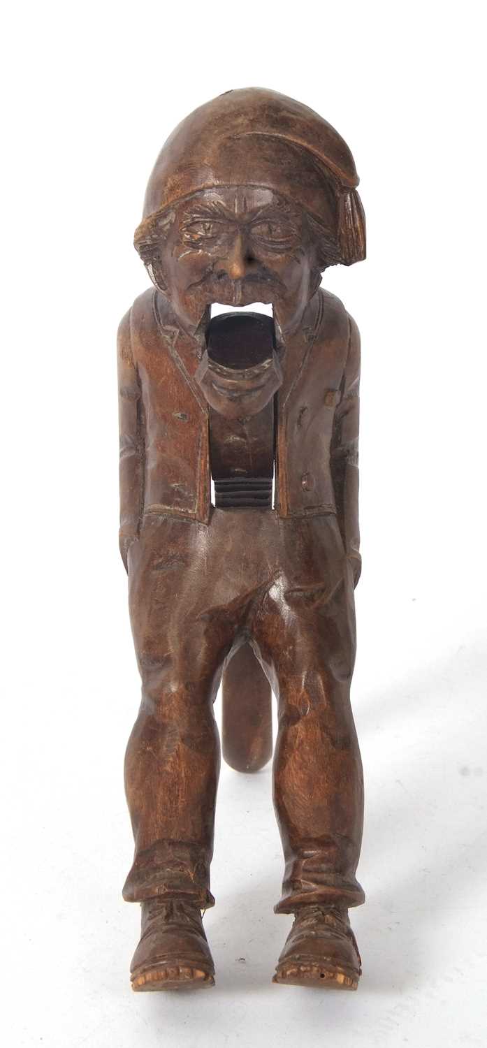 A vintage Black Forest nut cracker, circa 1930 of figural form showing a seated older man with a - Image 3 of 7