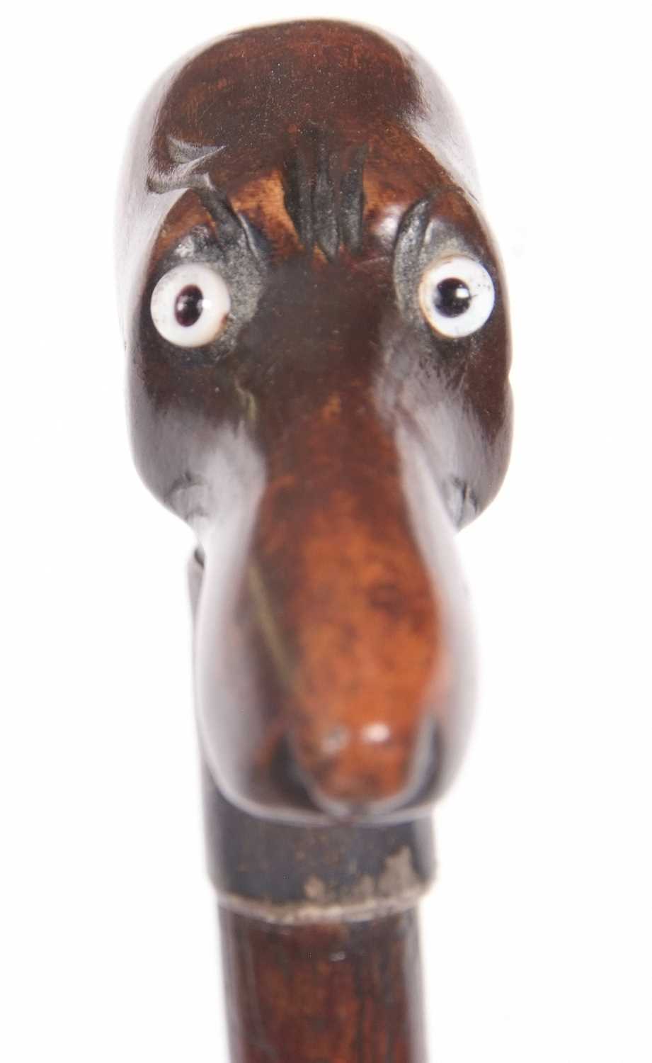 A walking stick carved with a dogs head handle, set with glass eyes and having a silver collar, - Image 3 of 8