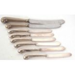 Six silver pistol handled knives, hallmarked for Sheffield 1920/21, makers mark William Yates Ltd