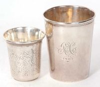 A hallmarked silver beaker of plain tapering form, Birmingham 1905, makers mark for Hilliard &