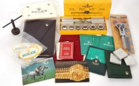 Mixed Lot: Various watch accessories to include Rolex booklet, badges and cloths and one Rolex