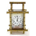 Al Elliot & Son of London clock, the clock has a glass front and back with two enamel side panels