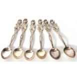 A cased set of six silver Russian teaspoons with decorative floral and leaf handles, the bowls