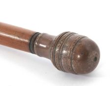 A vintage cut down stick with bamboo shaft with screw off acorn shaped top, revealing a screw lidded