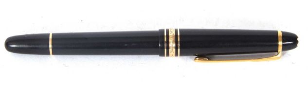 A Montblanc Meisterstuck fountain pen, screw on cap, gold trim on jet black high-grade resin, nib