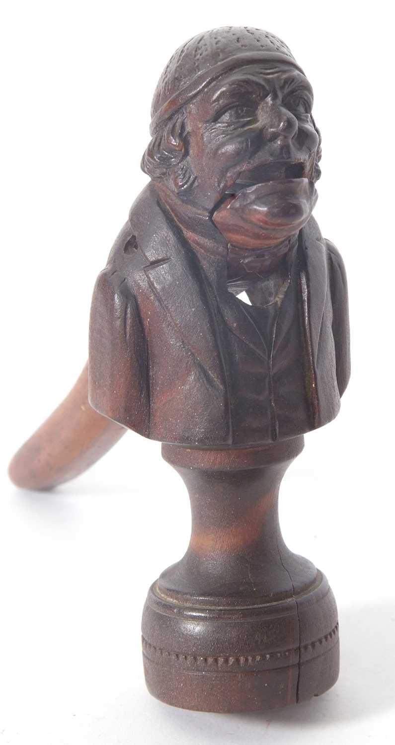 Vintage carved nut cracker of a mans head and torso on a plinth base, 15cm tall