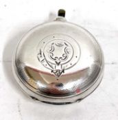 An Edwardian circular silver sovereign case of typical form, spring catch opening (a/f), engraved