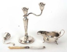 Mixed Lot: Hallmarked silver candelabra (broken), a George VI sauce boat of typical form, Birmingham