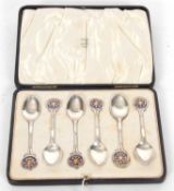 Motoring Interest - Cased set of six George V silver and enamel teaspoons with pierced blue and