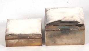 Mixed Lot: Two silver cigarette/boxes of square form, wood lined and loaded bases, marks rubbed