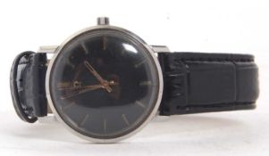 A vintage Omega gents wristwatch, the watch has a manually crown wound movement, Omega stamped crown