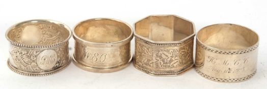 A group of four hallmarked silver serviette rings, three round and one octagonal example, various