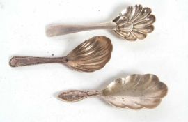 A George III silver caddy spoon having an oval shaped shell bowl and beaded edge detail to the