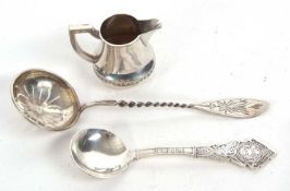 Mixed Lot: A continental white metal sifting spoon with round pierced bowl and twist stem,