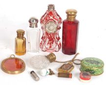 A vintage red velvet and brass box containing seven various scent bottles, an oval gilt framed