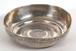 An antique Persian/Middle Eastern style white metal bowl chased with a geometric design, 20cm