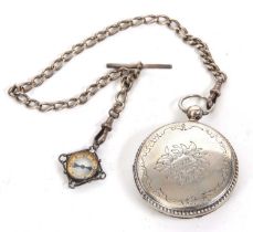 A Railway Timekeeper pocket watch with silver albert chain, the pocket watch has a key wound
