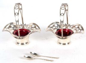 Pair of Edward bonbon baskets with pierced decoration, having cranberry glass liners, hallmarked