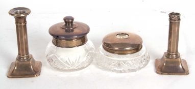 Mixed Lot: A pair of silver dressing table candlesticks, loaded, hallmarked for 1923, makers mark