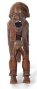 A vintage Black Forest nut cracker, circa 1930 of figural form showing a seated older man with a