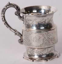 A Victorian silver small mug of cylindrical form, engraved and chased with birds, deer and foliate