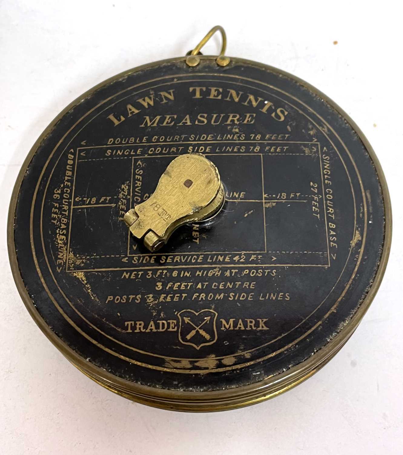 A rare early vintage lawn tennis measure in original case with Jappened court dimensions, printed