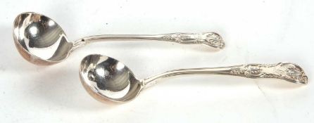 Two Kings pattern sauce ladles having oval shaped bowls and engraved detail, hallmarked London