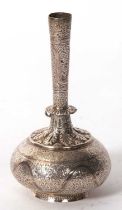 An Eastern white metal spill vase of tapering form with a slender neck to a bulbous body, chased and