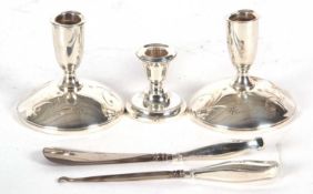 Mixed Lot: A pair of Gorham sterling dressing table candlesticks, (loaded) (a/f), a single small