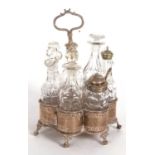 A Victorian silver framed seven bottle cruet stand, scallop formed with pierced symetrical