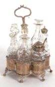 A Victorian silver framed seven bottle cruet stand, scallop formed with pierced symetrical